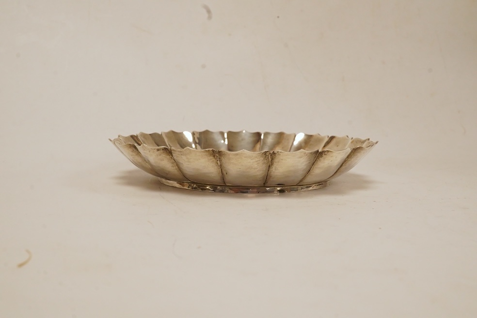 A modern silver dish by D.J. Anderson, London, 1998, diameter 14.4cm, together with a George III silver Old English pattern table spoon, by Peter, Ann & William Bateman, London, 1803, 7.8oz. Condition - fair to good